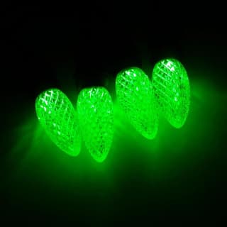 Green C9 faceted LED bulbs lit at night