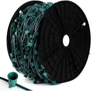 Green C9 socket spool with 12-inch spacing, 1000 ft, with a close-up of an E17 socket